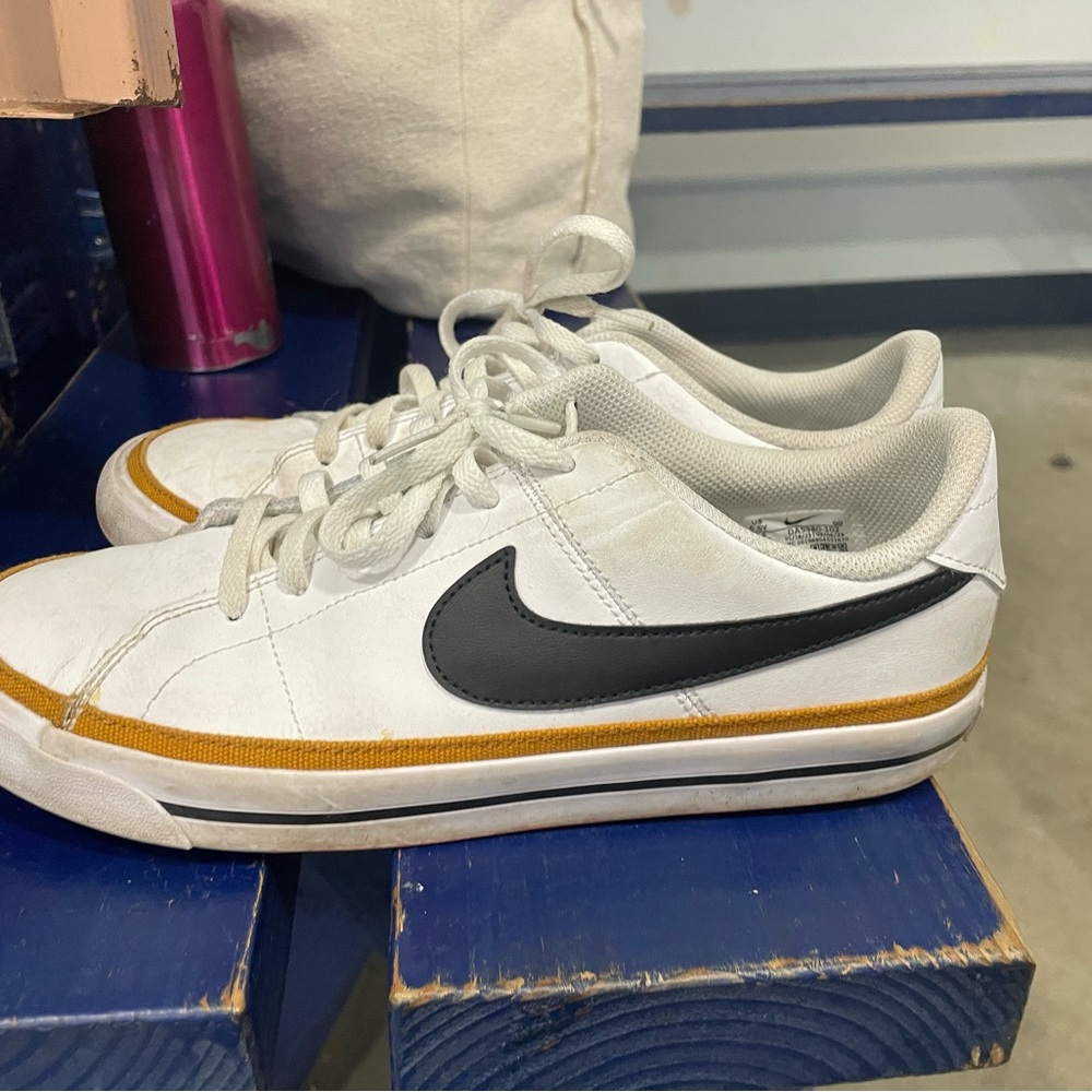 Nike Men's White and Black Sneakers with Gold Accents